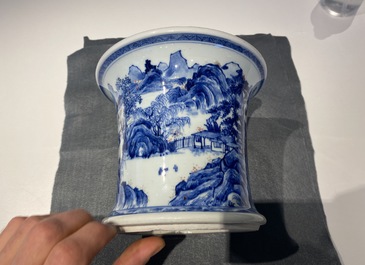 A fine Chinese blue, white and copper red 'Master of the Rocks' brush pot, Kangxi